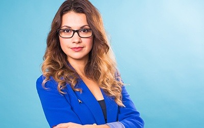 Professional woman against blue background