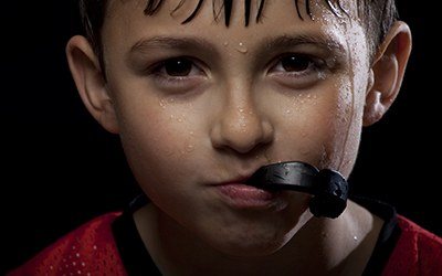Young boy with athletic mouthguard